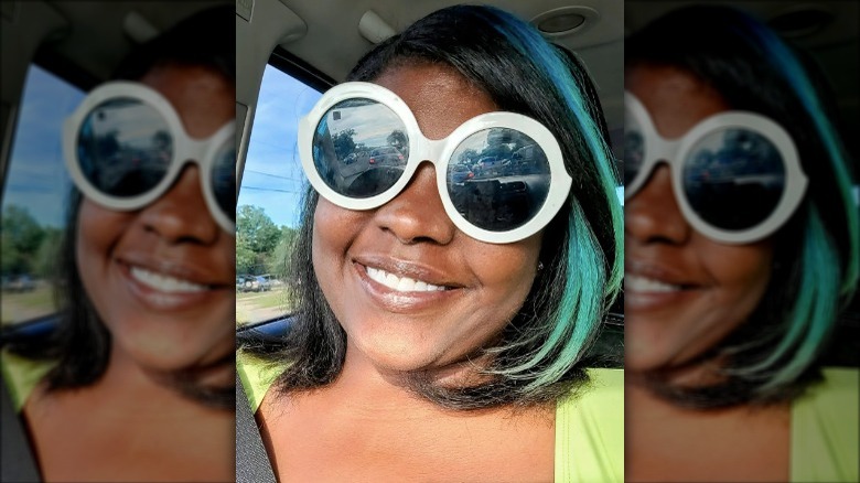 Smiling woman with blue highlights