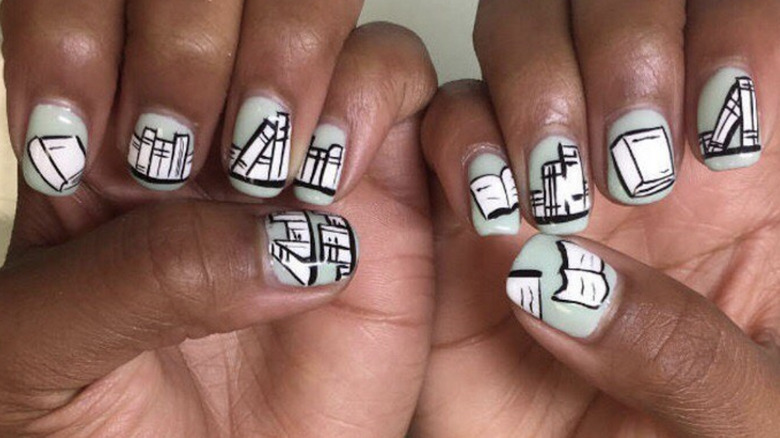 manicure of books on mint green background
