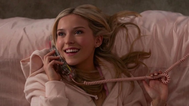 Lexi Minetree as a young Elle Woods talking on the phone