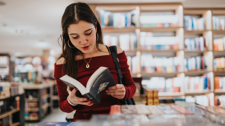Woman browsing books in a book store
