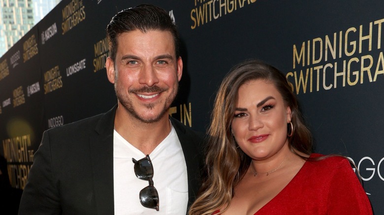 Brittany Cartwright and Jax Taylor posing on the red carpet together