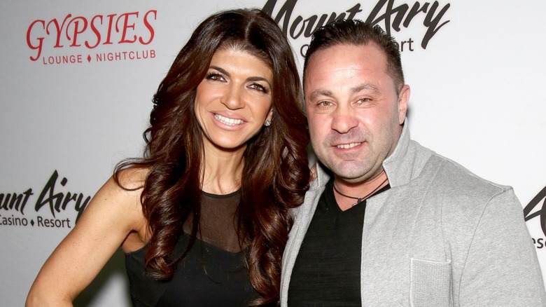 Teresa Giudice and Joe Giudice smiling next to each other on the red carpet