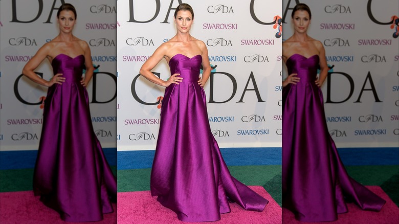 Bridget Moynahan in a purple strapless gown at an event in 2014