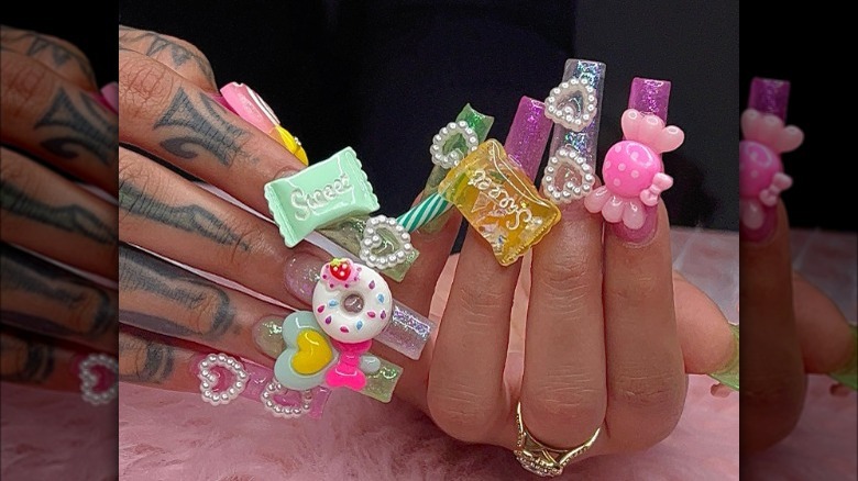 manicure with colorful charms