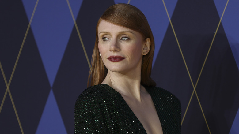 Bryce Dallas Howard looking over her shoulder and wearing dark lipstick