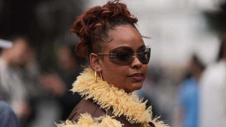 woman in curly bun hairstyle