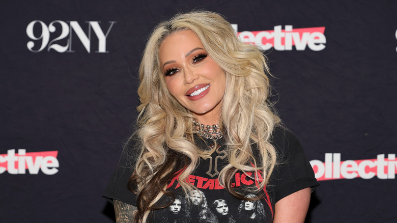 Bunnie Xo on the red carpet in a graphic t-shirt and wearing her hair down