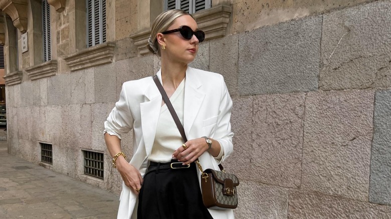 Lydia Tomlinson wearing a white blazer outfit