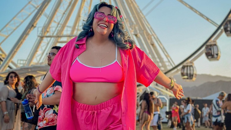 person posing in pink outfit 