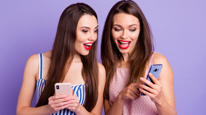 Women red lipstick on iPhones
