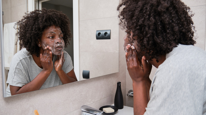 woman washing face