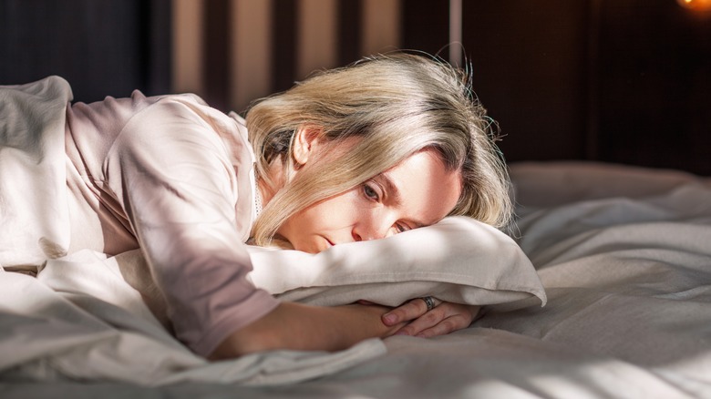 woman with her face on pillow