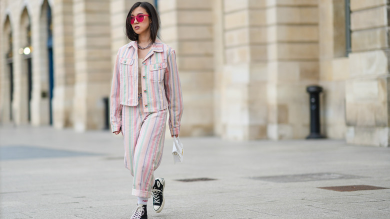 A woman in a pink outfit 