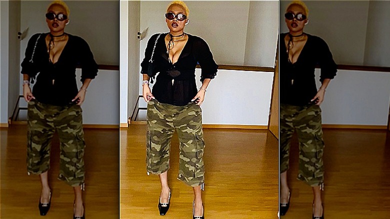 Heels, sunglasses, and camo capris
