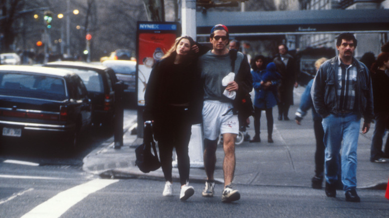 John F. Kennedy Jr. and Carolyn Bessette walking side-by-side in New York