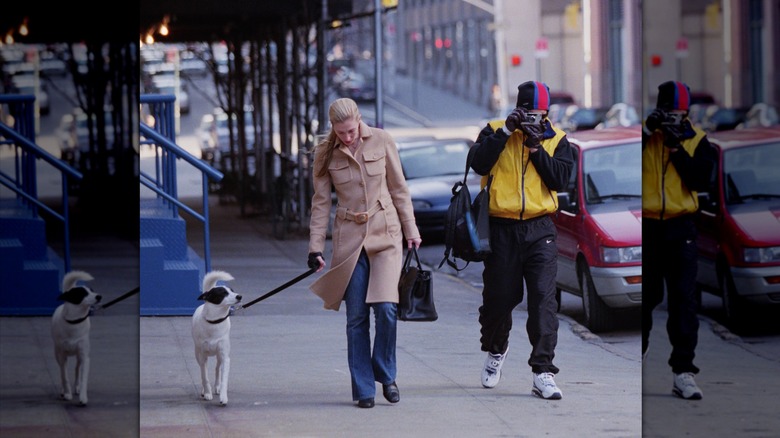 Carolyn Bessette Kennedy wearing a tan overcoat and blue jeans