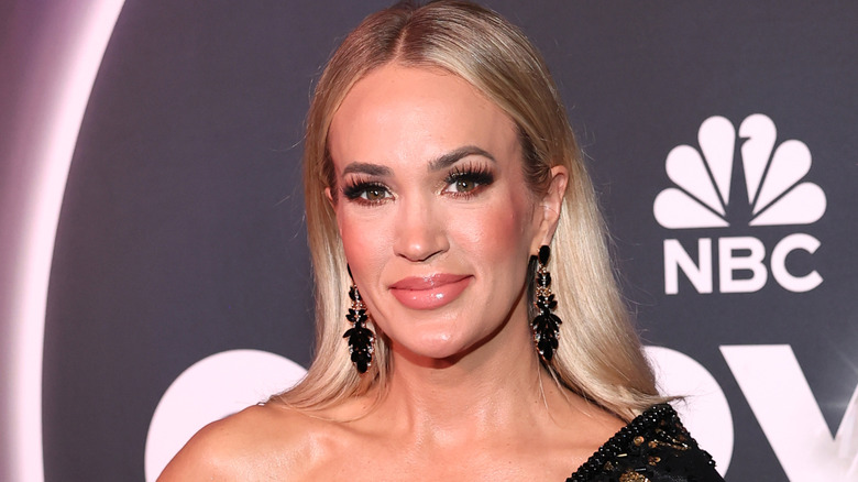 Carrie Underwood smiles on the red carpet in 2025