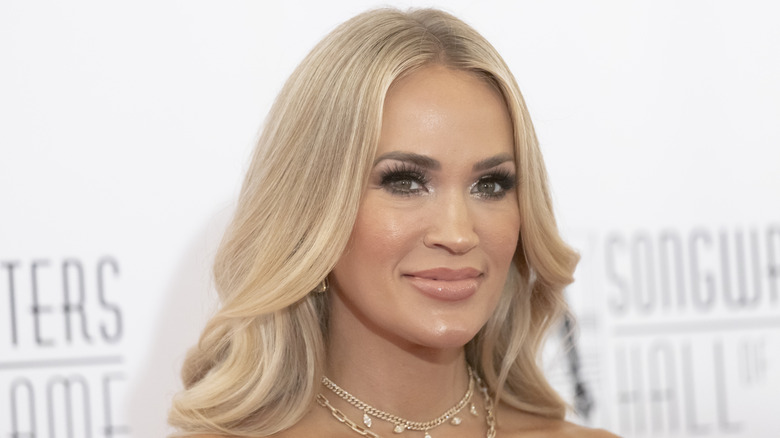 Carrie Underwood smiles on the red carpet in 2024