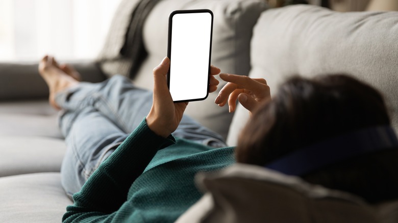 woman looking at phone