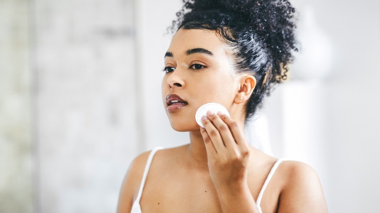 Woman applying toner