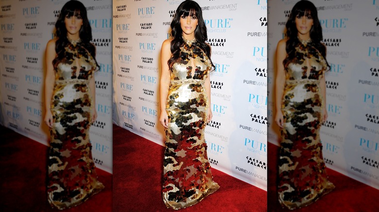 Kim Kardashian in a gold dress on New Year's Eve