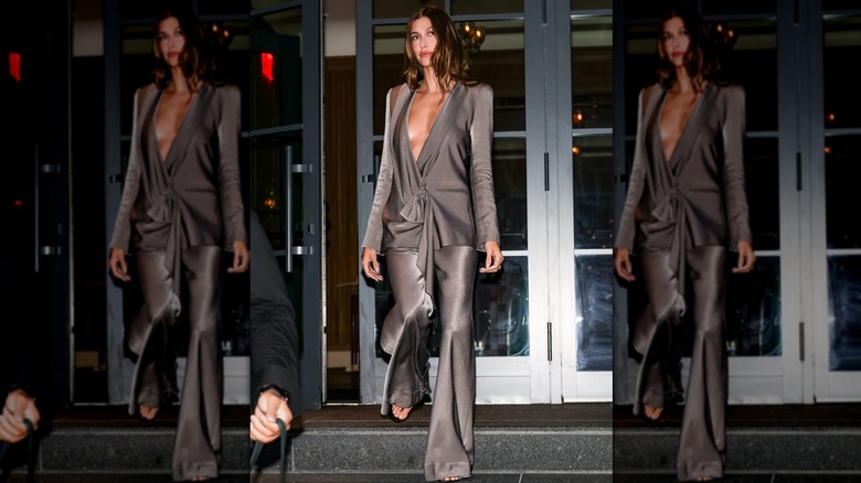 Hailey Bieber in a silver pant suit in New York City