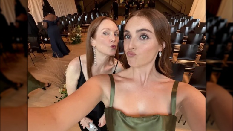 Julianne Moore posing for a selfie alongside her daughter, Liv Freundlich, as they both make a kissy face