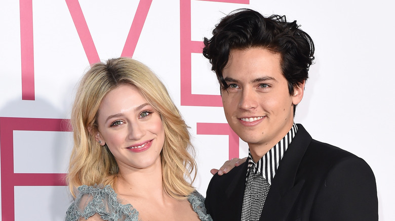 Lili Reinhart and Cole Sprouse posing