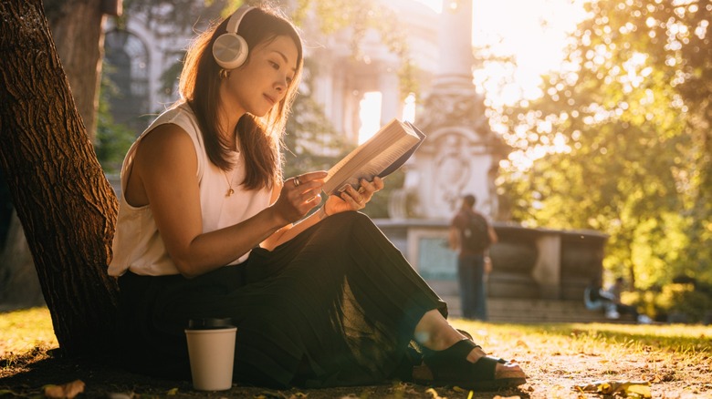 A woman reading outside