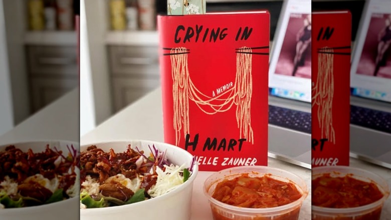 A copy of the book "Crying In H Mart" with food in the foreground