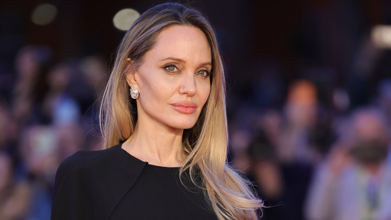 Angelina Jolie posing at a 2025 film festival screening