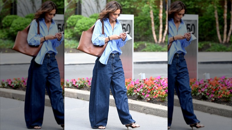 Katie Holmes in jeans and a blue shirt while walking outside