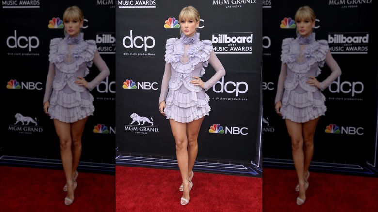 Taylor Swift in a lilac, ruffled dress on the 2019 Billboard Music Awards red carpet