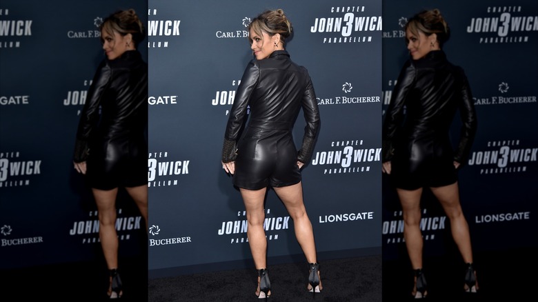 Halle Berry wearing all black leather playsuit