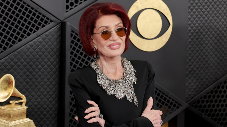 Sharon Osbourne on the red carpet where a bejeweled collar necklace