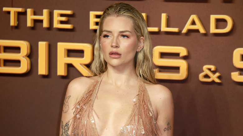 Lottie Moss on the red carpet in a nude colored dress