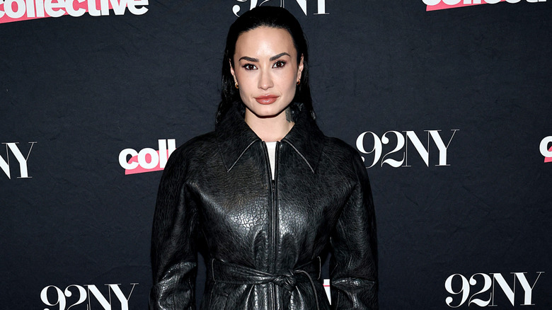 Demi Lovato on the red carpet with her hair slicked back