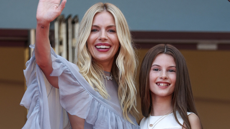 Sienna Miller with daughter, Marlowe Sturridge, at the Horizon: An American Saga Red Carpet