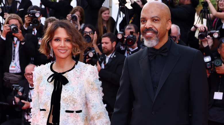 Halle Berry and Van Hunt attend the "The Phoenician Scheme" red carpet at the 78th annual Cannes Film Festival at Palais des Festivals on May 18, 2025 in Cannes