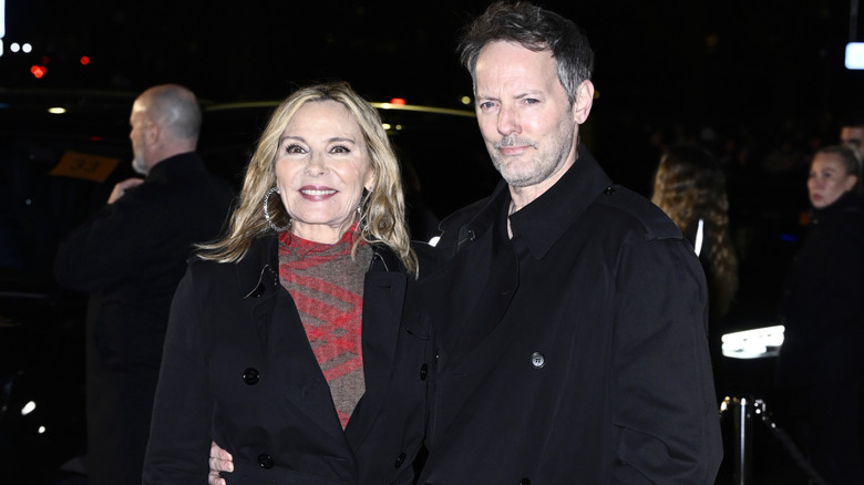 Kim Cattrall and Russell Thomas attend the Burberry show during London Fashion Week February 2025