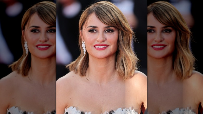 Close-up of Penelope Crus wearing a smokey eye and strapless dress at a red carpet event