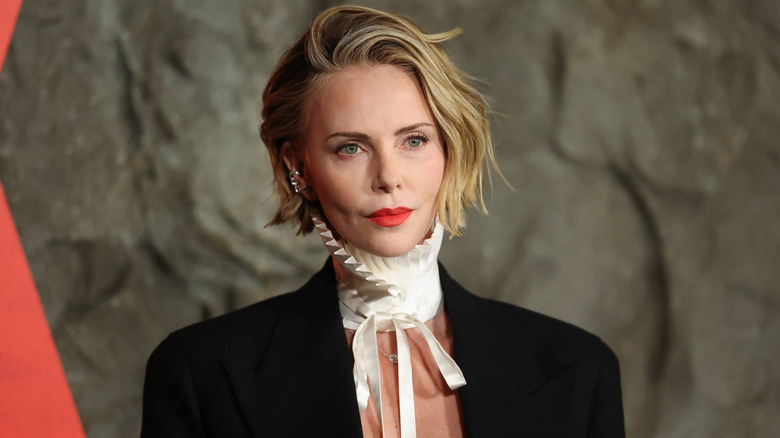 Charlize Theron poses on the red carpet in 2026