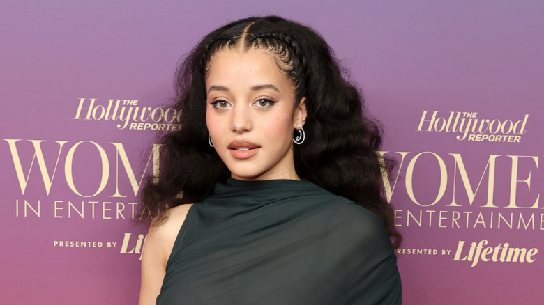 Chase Infiniti wearing a black dress