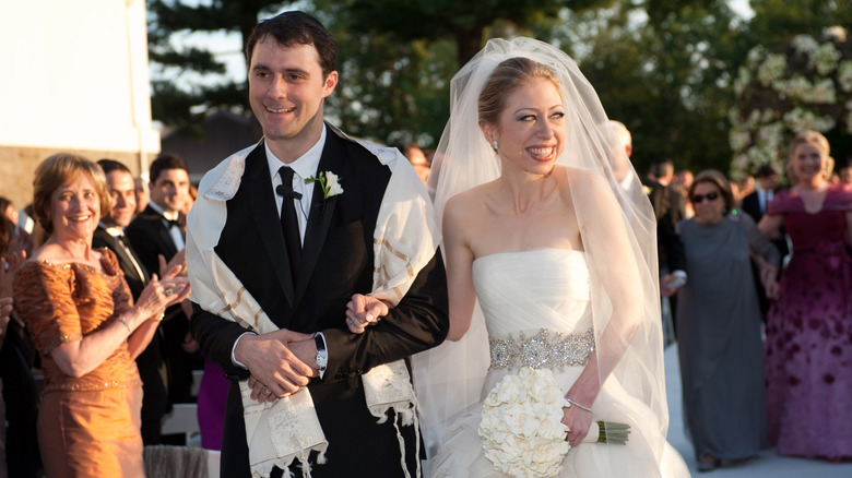 Chelsea Clinton and Marc Mezvinsky smile during their wedding in 2010