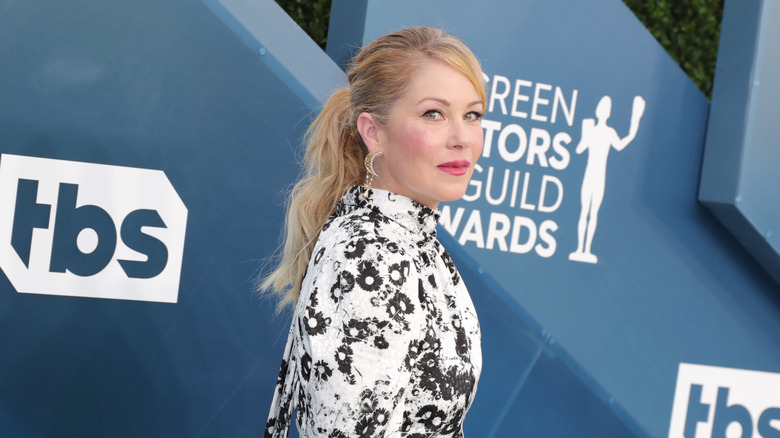 Christina Applegate on the red carpet in a black and white dress