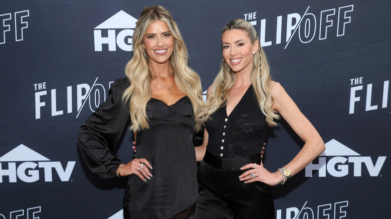 Christina Haack and Heather Rae El Moussa posing together on the red carpet at an event