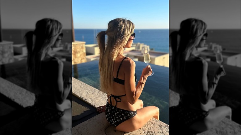 Christina Haack relaxing by the pool in a black bikini in November 2024