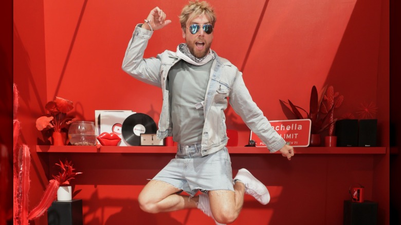 Lance Bass wearing a denim jacket and shorts