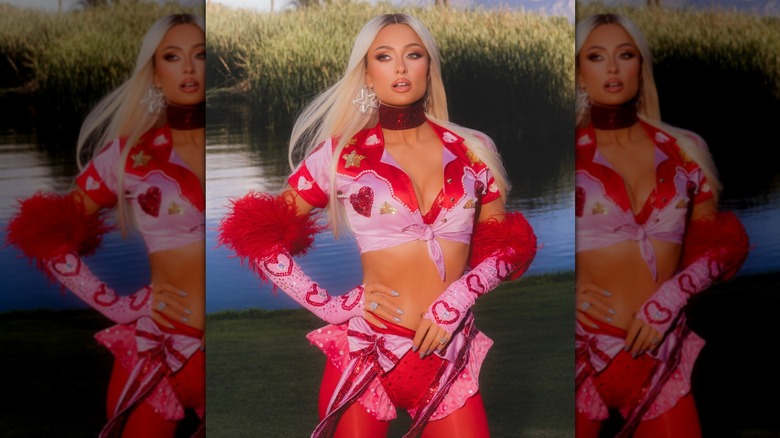 Paris Hilton wearing a pink and red outfit
