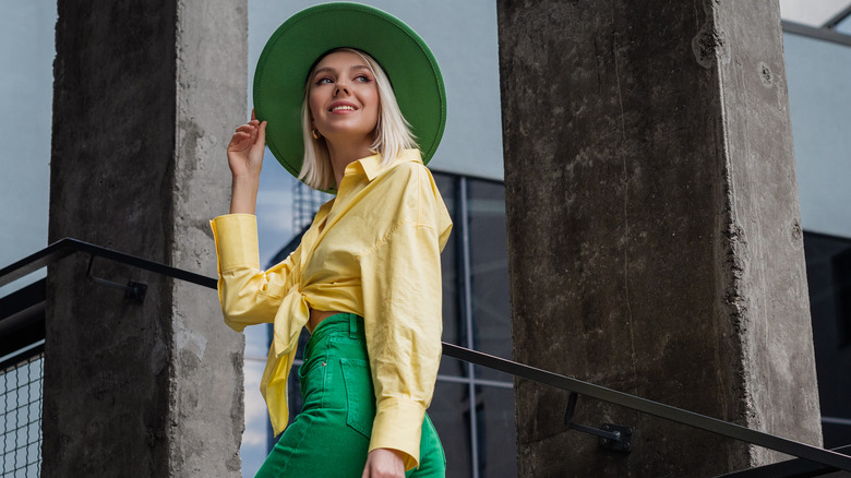 Woman wearing yellow and green